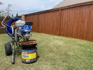 HOA fence stained by Patriot Fence and Stain in the Rushbrook Addition neighborhood of Edmond, Oklahoma, featuring a consistent professional finish that enhances curb appeal across the community.